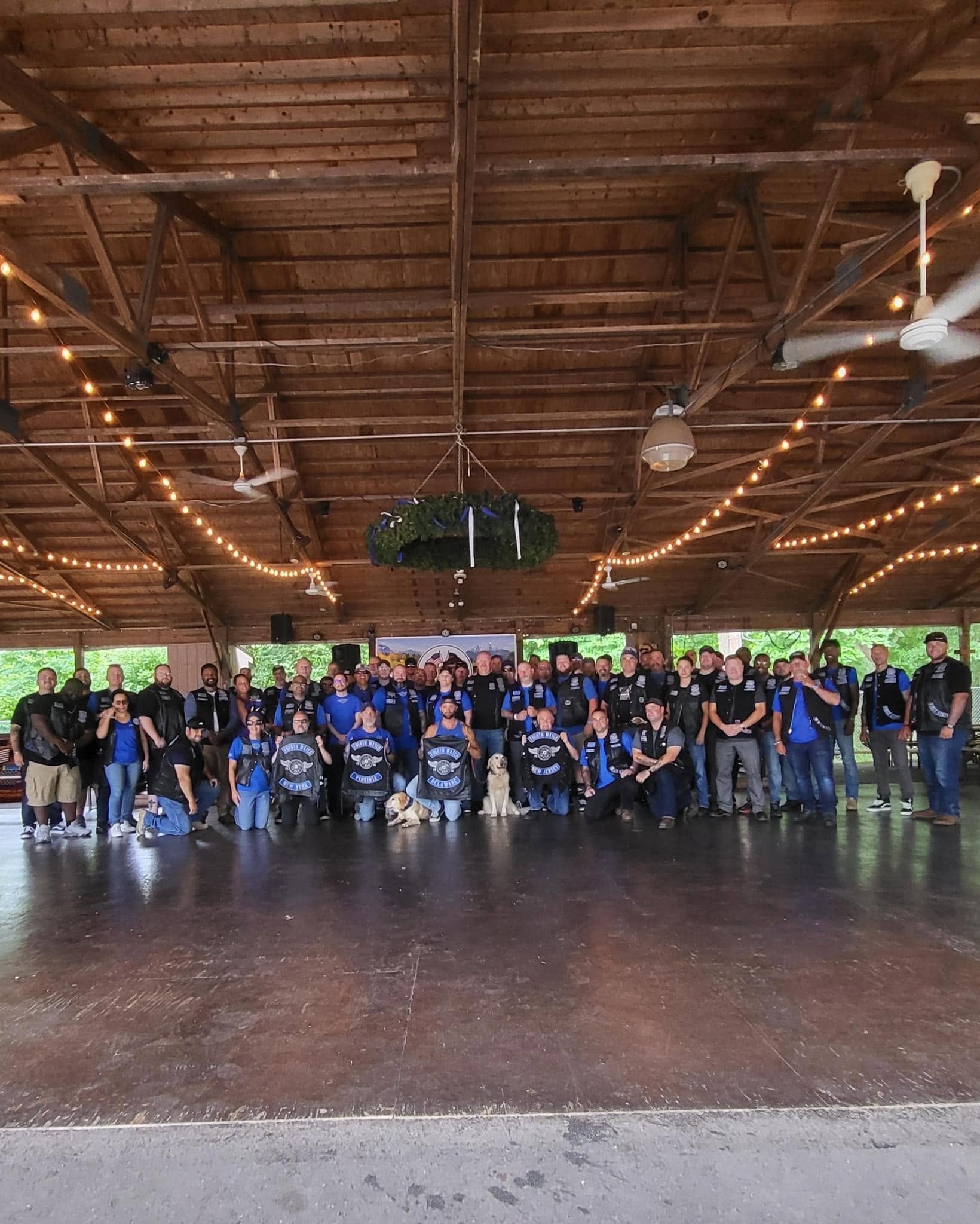 Fourth Watch members gathered together under a pavilion