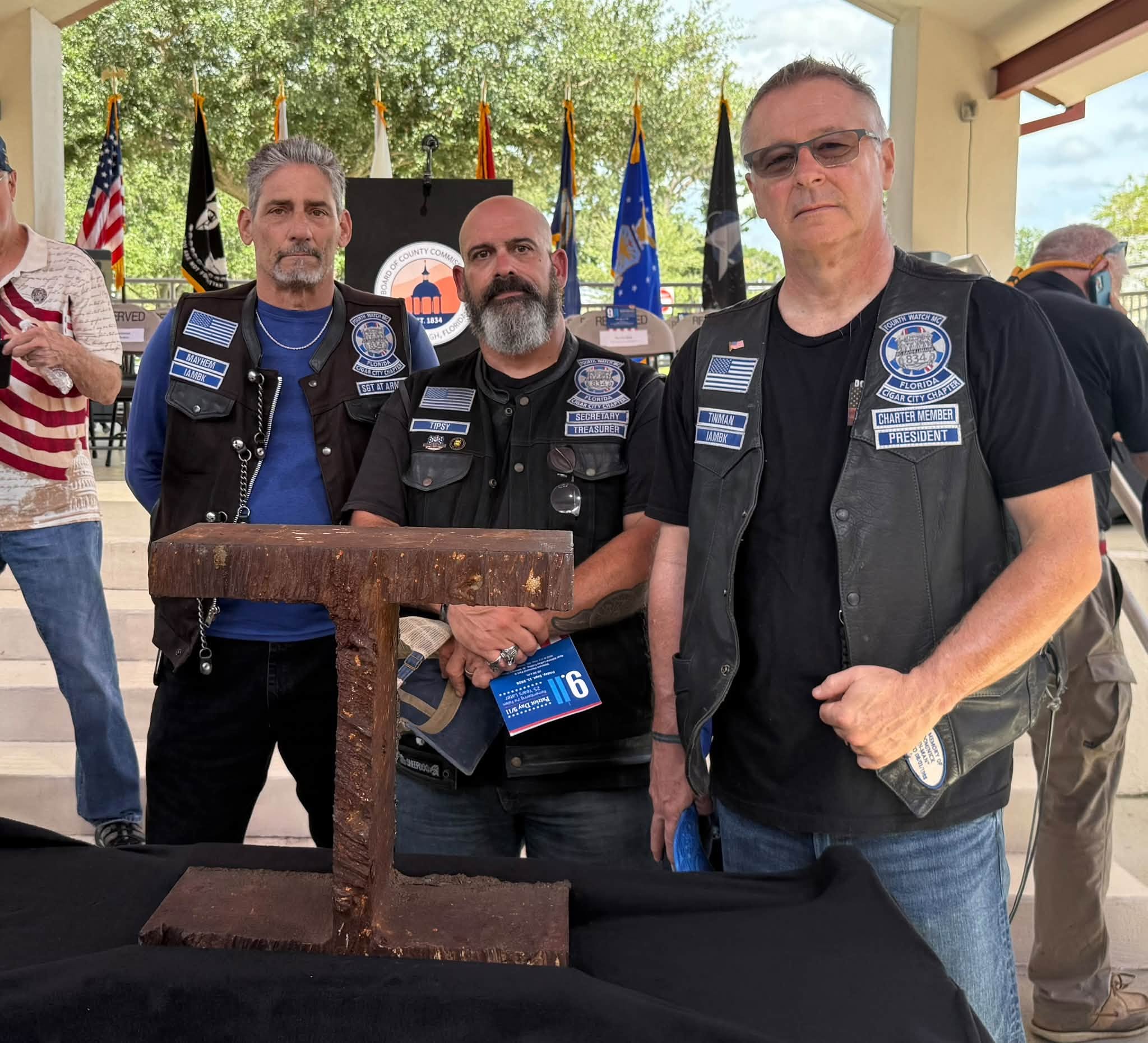 Fourth Watch members beside the World Trade Center steel memorial